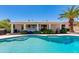 Beautiful swimming pool with large patio, landscaping and a covered outdoor seating area at 3020 E Mission Ln, Phoenix, AZ 85028