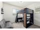 Cozy bedroom featuring a loft bed, desk area, and comfortable seating at 3231 S Mingus Dr, Chandler, AZ 85286