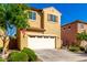 Inviting two-story home with a two car garage, manicured landscaping, and warm curb appeal at 3231 S Mingus Dr, Chandler, AZ 85286