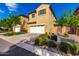 Inviting two-story home with a two car garage, manicured landscaping, and warm curb appeal at 3231 S Mingus Dr, Chandler, AZ 85286