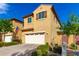 Inviting two-story home with a two car garage, manicured landscaping, and warm curb appeal at 3231 S Mingus Dr, Chandler, AZ 85286