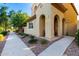 Inviting exterior showcasing a cozy front porch, landscaped yard, and attractive architectural details at 3231 S Mingus Dr, Chandler, AZ 85286