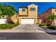 Inviting two-story home with a two car garage, manicured landscaping, and warm curb appeal at 3231 S Mingus Dr, Chandler, AZ 85286