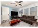 Comfortable living room with stylish furniture, ceiling fan, and plenty of natural light at 3231 S Mingus Dr, Chandler, AZ 85286