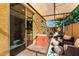 Inviting covered patio with comfortable seating, outdoor grill, and brick flooring at 3231 S Mingus Dr, Chandler, AZ 85286