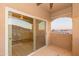 This balcony features sliding glass doors and string lights, perfect for enjoying the outdoors at 3236 E Chandler Blvd # 3031, Phoenix, AZ 85048