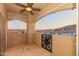Balcony with string lights and sunset views of the Phoenix Mountain Preserve at 3236 E Chandler Blvd # 3031, Phoenix, AZ 85048