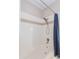 Bathroom featuring a tile shower and tub with a neutral toned accent stripe at 3236 E Chandler Blvd # 3031, Phoenix, AZ 85048