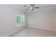 Bright bedroom featuring a modern ceiling fan and light gray vinyl plank flooring at 3236 E Chandler Blvd # 3031, Phoenix, AZ 85048