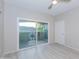 Bedroom featuring sliding glass door access to a balcony and ceiling fan at 3236 E Chandler Blvd # 3031, Phoenix, AZ 85048