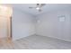 Bedroom features a modern ceiling fan, recessed lights, and light wood flooring at 3236 E Chandler Blvd # 3031, Phoenix, AZ 85048