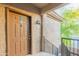 Entrance to a condo with a covered porch, desert landscaping, and secure access at 3236 E Chandler Blvd # 3031, Phoenix, AZ 85048