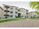 Multi-story apartment building featuring stucco siding, private balconies, and well-maintained landscaping at 3236 E Chandler Blvd # 3031, Phoenix, AZ 85048