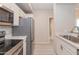 Full kitchen view featuring stainless steel appliances and eat-in breakfast bar at 3236 E Chandler Blvd # 3031, Phoenix, AZ 85048