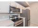 Close-up of stainless steel oven, cooktop, and microwave in the kitchen at 3236 E Chandler Blvd # 3031, Phoenix, AZ 85048