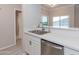 Stainless steel kitchen sink with bar top overlooking view outside the window at 3236 E Chandler Blvd # 3031, Phoenix, AZ 85048