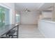 Bright, open-concept living space featuring modern light-wood-look flooring at 3236 E Chandler Blvd # 3031, Phoenix, AZ 85048