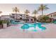 Resort-style pool with palm trees, waterfalls, a spa, and plenty of seating for residents at 3236 E Chandler Blvd # 3031, Phoenix, AZ 85048