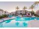 Beautiful community pool featuring palm trees, a spa, and comfortable seating for residents at 3236 E Chandler Blvd # 3031, Phoenix, AZ 85048