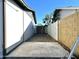 Backyard view with concrete patio, side gate, block fence, and view of the neighborhood at 344 E Jacaranda St, Mesa, AZ 85201