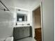 Bright bathroom featuring a modern vanity with a sleek, illuminated mirror at 344 E Jacaranda St, Mesa, AZ 85201