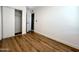 Spacious bedroom with wood-look floors and a large closet at 344 E Jacaranda St, Mesa, AZ 85201