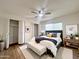 Stylishly decorated bedroom featuring hardwood floors, modern furniture, and walk-in closets at 344 E Jacaranda St, Mesa, AZ 85201