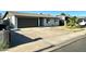 Charming single-story home with a well-maintained front yard and a two-car garage at 344 E Jacaranda St, Mesa, AZ 85201