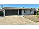 Well-lit single-story home with a neat front yard and a convenient two-car garage at 344 E Jacaranda St, Mesa, AZ 85201