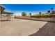 Spacious backyard featuring a wall, gravel landscape, and a covered patio at 4121 W Paradise Dr, Phoenix, AZ 85029