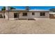 Backyard with covered patio, with gravel landscape at 4121 W Paradise Dr, Phoenix, AZ 85029