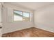 Bright bedroom featuring a window with shutters, ample natural light, and closet space at 4121 W Paradise Dr, Phoenix, AZ 85029