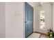 Inviting entryway showcases a stylish front door, light fixture, and view to front yard at 4121 W Paradise Dr, Phoenix, AZ 85029