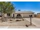Charming single-story home features a two-car garage, desert landscaping, and a cozy front porch at 4121 W Paradise Dr, Phoenix, AZ 85029
