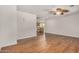 Spacious living room features wood-look floors, an open floor plan, and neutral paint at 4121 W Paradise Dr, Phoenix, AZ 85029