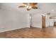 Bright living room featuring wood-look flooring, ceiling fan, and neutral paint at 4121 W Paradise Dr, Phoenix, AZ 85029