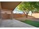 Covered patio and desert-landscaped backyard, perfect for outdoor living at 418 E Clairidge Dr, San Tan Valley, AZ 85143