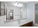 Bathroom features a large mirror over a vanity with a sink at 418 E Clairidge Dr, San Tan Valley, AZ 85143