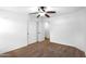This bright bedroom features carpet, a ceiling fan, and a closet for ample storage at 418 E Clairidge Dr, San Tan Valley, AZ 85143