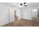 Cozy bedroom with carpet flooring and a view into an adjacent room at 418 E Clairidge Dr, San Tan Valley, AZ 85143