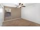 Comfortable bedroom with neutral carpet, ceiling fan and window with blinds at 418 E Clairidge Dr, San Tan Valley, AZ 85143