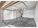 Spacious two-car garage with epoxy floors and plenty of storage cabinets at 418 E Clairidge Dr, San Tan Valley, AZ 85143