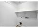 Laundry room with white walls and shelving at 418 E Clairidge Dr, San Tan Valley, AZ 85143