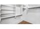 Bright walk-in closet with built-in shelving and rod system for optimal organization at 418 E Clairidge Dr, San Tan Valley, AZ 85143