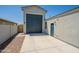 Exterior of house features a spacious backyard with an extra detached garage and gray stone accents at 4215 W Suncup Dr, San Tan Valley, AZ 85144
