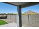 Covered patio with a mountain view and block wall offers a serene outdoor living space at 4215 W Suncup Dr, San Tan Valley, AZ 85144