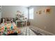 This is a bedroom featuring bright decor, a desk, and a comfortable bed at 4215 W Suncup Dr, San Tan Valley, AZ 85144
