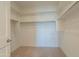 A walk-in closet offers ample shelving and hanging space for storage at 4215 W Suncup Dr, San Tan Valley, AZ 85144