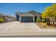 Charming single-story home with a well-manicured front yard and an extra detached garage at 4215 W Suncup Dr, San Tan Valley, AZ 85144