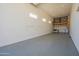 Bright garage featuring high ceilings, overhead storage and a washer and dryer at 4215 W Suncup Dr, San Tan Valley, AZ 85144